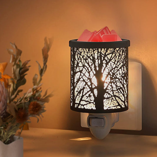 Plug-in electric wax melt warmer plugged into a wall outlet